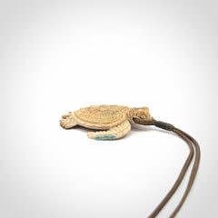 This is a beautiful hand carved woolly mammoth tusk turtle pendant. A really cool piece that is made from this rare and beautiful material. The mammoth has a very distinctive grain and each piece is different. We ship this worldwide and the cost of shipping is included in the price.