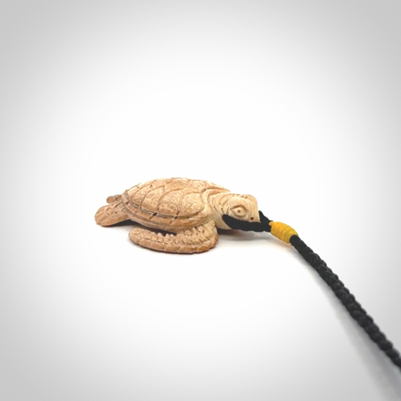 This is a beautiful hand carved woolly mammoth tusk turtle pendant. A really cool piece that is made from this rare and beautiful material. The mammoth has a very distinctive grain and each piece is different. We ship this worldwide and the cost of shipping is included in the price.
