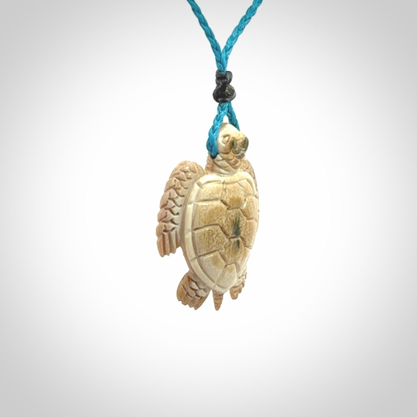 This is a beautiful hand carved woolly mammoth tusk turtle pendant. A really cool piece that is made from this rare and beautiful material. The mammoth has a very distinctive grain and each piece is different. We ship this worldwide and the cost of shipping is included in the price.