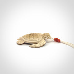 This is a beautiful hand carved woolly mammoth tusk turtle pendant. A really cool piece that is made from this rare and beautiful material. The mammoth has a very distinctive grain and each piece is different. We ship this worldwide and the cost of shipping is included in the price.