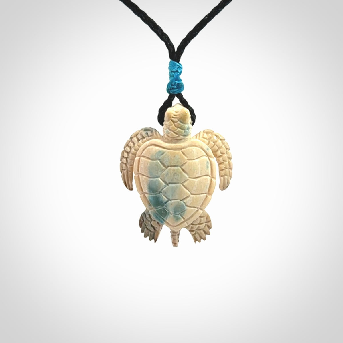 This is a beautiful hand carved woolly mammoth tusk turtle pendant. A really cool piece that is made from this rare and beautiful material. The mammoth has a very distinctive grain and each piece is different. We ship this worldwide and the cost of shipping is included in the price.