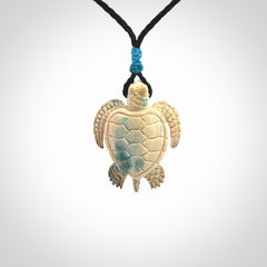 This is a beautiful hand carved woolly mammoth tusk turtle pendant. A really cool piece that is made from this rare and beautiful material. The mammoth has a very distinctive grain and each piece is different. We ship this worldwide and the cost of shipping is included in the price.