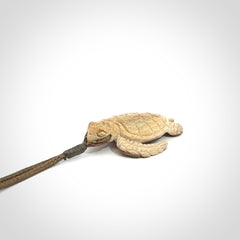 This is a beautiful hand carved woolly mammoth tusk turtle pendant. A really cool piece that is made from this rare and beautiful material. The mammoth has a very distinctive grain and each piece is different. We ship this worldwide and the cost of shipping is included in the price.