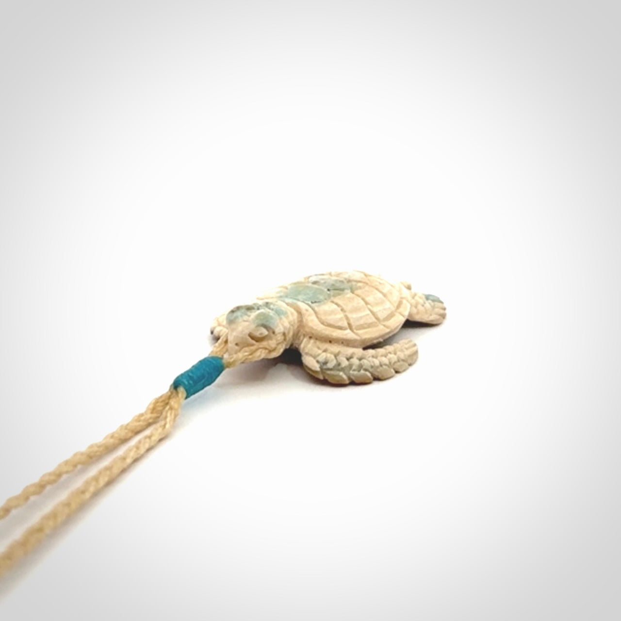 This is a beautiful hand carved woolly mammoth tusk turtle pendant. A really cool piece that is made from this rare and beautiful material. The mammoth has a very distinctive grain and each piece is different. We ship this worldwide and the cost of shipping is included in the price.