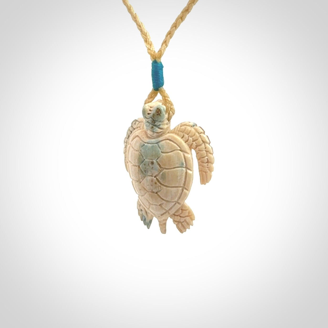 This is a beautiful hand carved woolly mammoth tusk turtle pendant. A really cool piece that is made from this rare and beautiful material. The mammoth has a very distinctive grain and each piece is different. We ship this worldwide and the cost of shipping is included in the price.