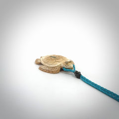 This is a beautiful hand carved woolly mammoth tusk turtle pendant. A really cool piece that is made from this rare and beautiful material. The mammoth has a very distinctive grain and each piece is different. We ship this worldwide and the cost of shipping is included in the price.