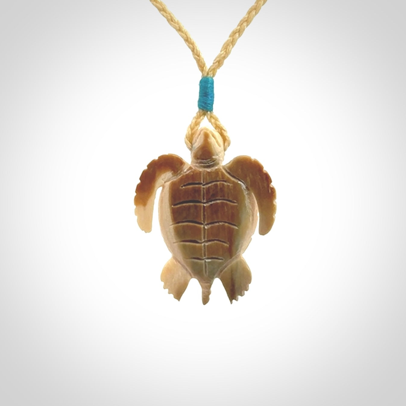 This is a beautiful hand carved woolly mammoth tusk turtle pendant. A really cool piece that is made from this rare and beautiful material. The mammoth has a very distinctive grain and each piece is different. We ship this worldwide and the cost of shipping is included in the price.