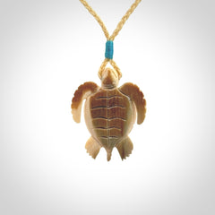 This is a beautiful hand carved woolly mammoth tusk turtle pendant. A really cool piece that is made from this rare and beautiful material. The mammoth has a very distinctive grain and each piece is different. We ship this worldwide and the cost of shipping is included in the price.