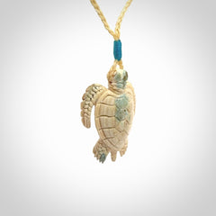This is a beautiful hand carved woolly mammoth tusk turtle pendant. A really cool piece that is made from this rare and beautiful material. The mammoth has a very distinctive grain and each piece is different. We ship this worldwide and the cost of shipping is included in the price.