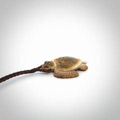 This is a beautiful hand carved woolly mammoth tusk turtle pendant. A really cool piece that is made from this rare and beautiful material. The mammoth has a very distinctive grain and each piece is different. We ship this worldwide and the cost of shipping is included in the price.