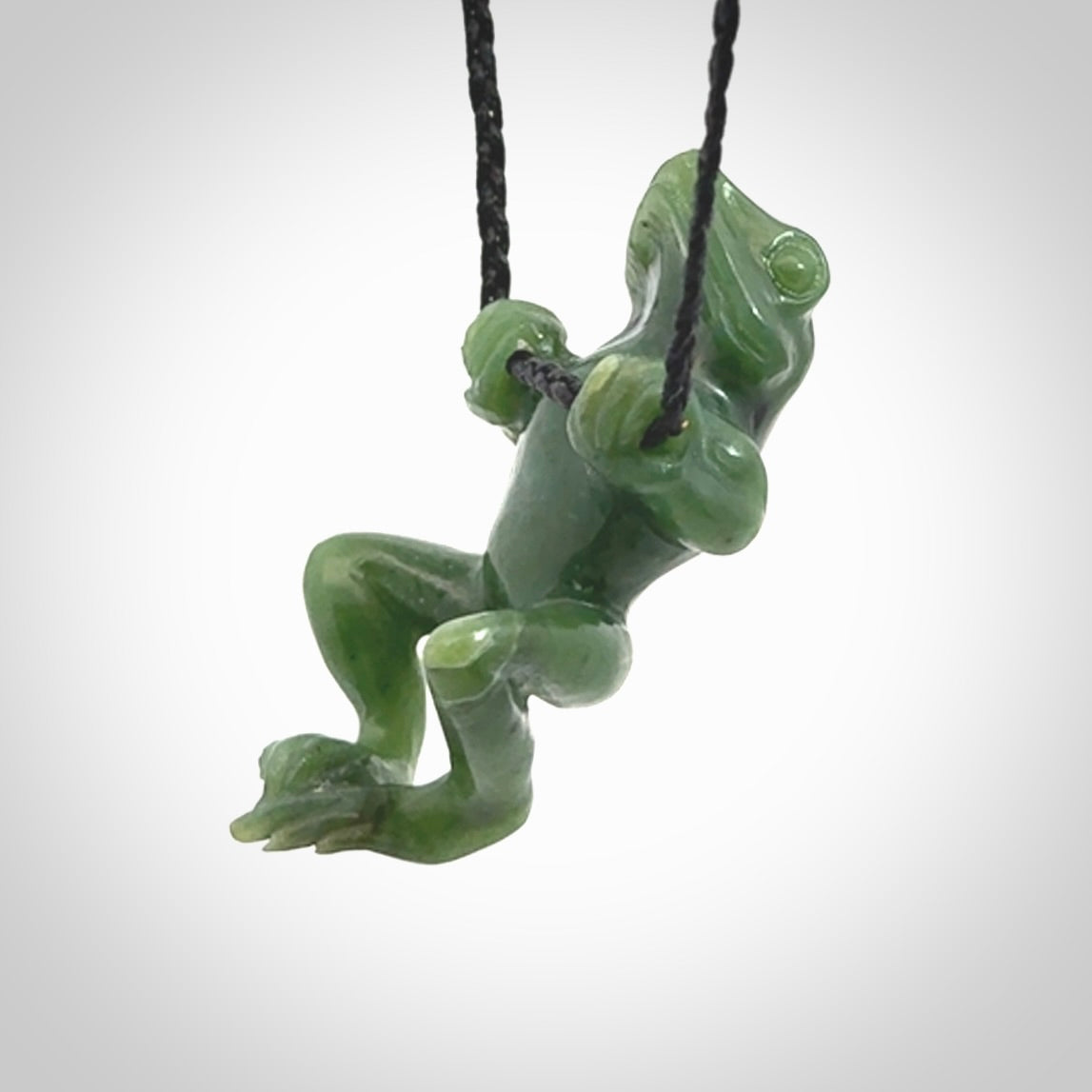 Hand carved jade frog pendant with adjustable cord.