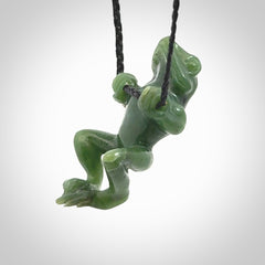 Hand carved jade frog pendant with adjustable cord.