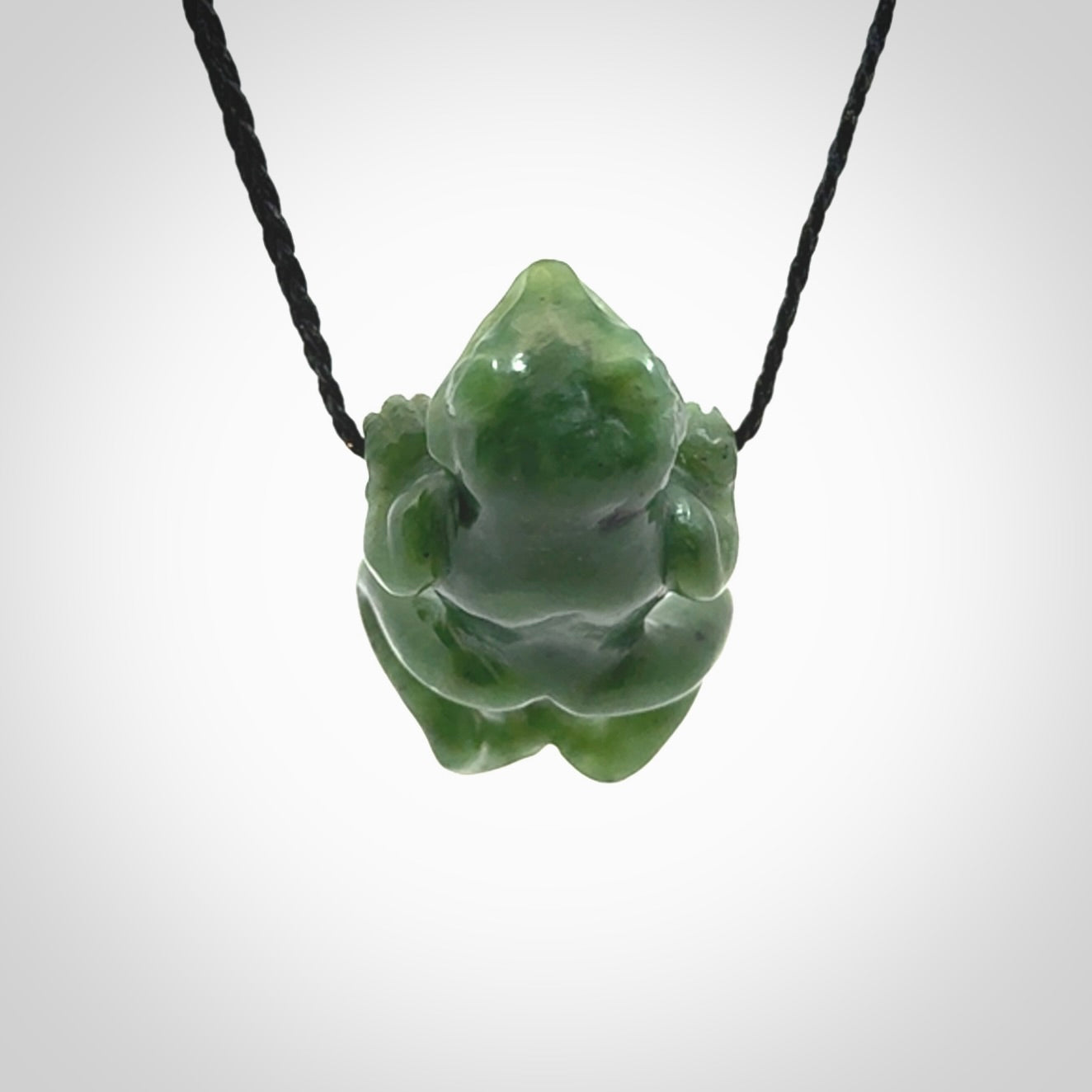 Hand carved jade frog pendant with adjustable cord.