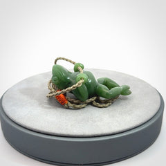 Hand carved jade frog pendant with adjustable cord.