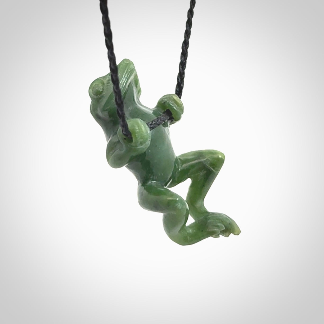 Hand carved jade frog pendant with adjustable cord.