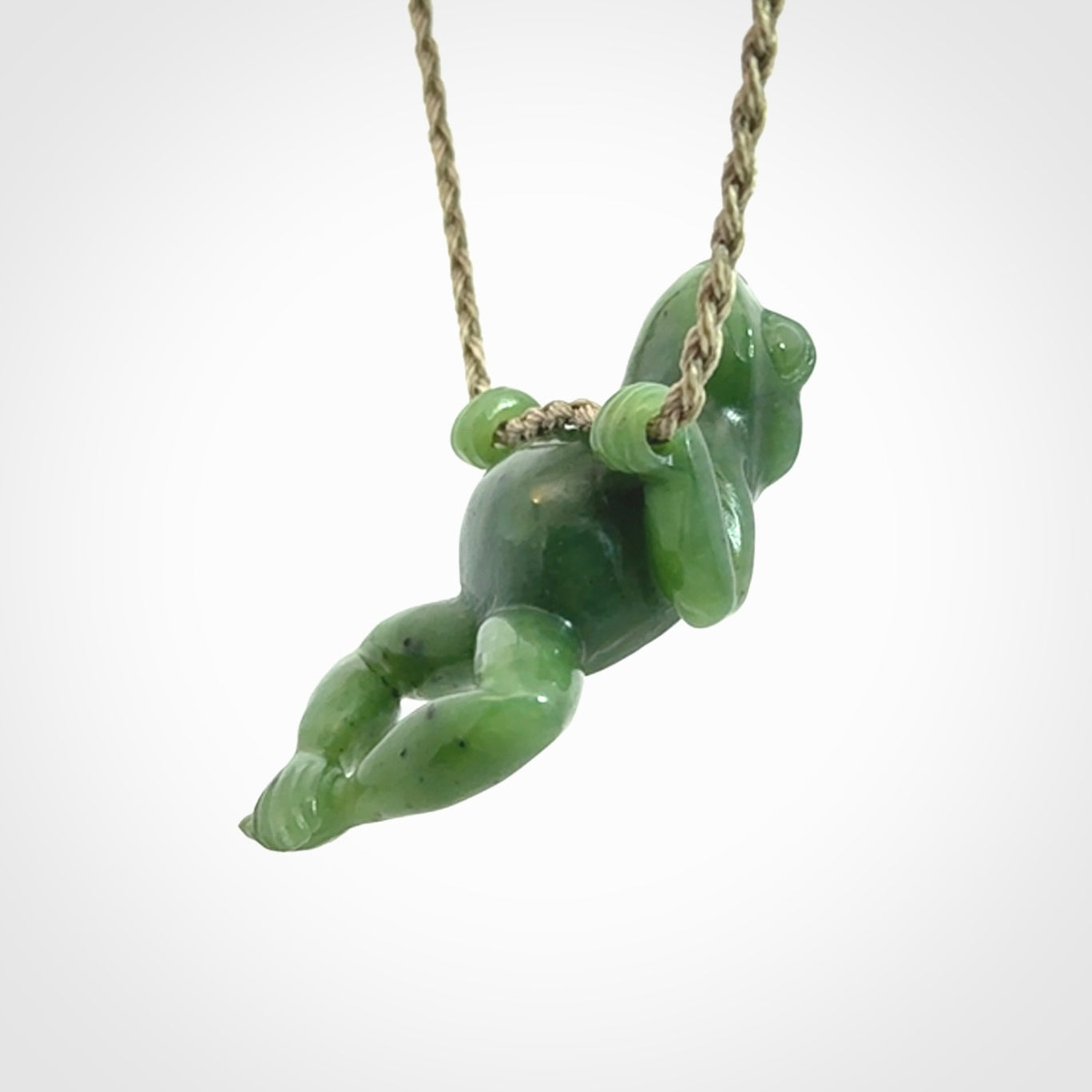 Hand carved jade frog pendant with adjustable cord.
