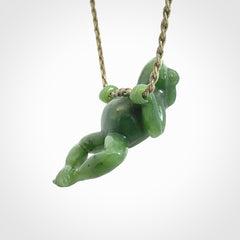 Hand carved jade frog pendant with adjustable cord.