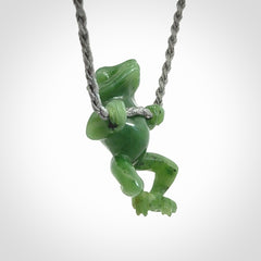 Hand carved jade frog pendant with adjustable cord.