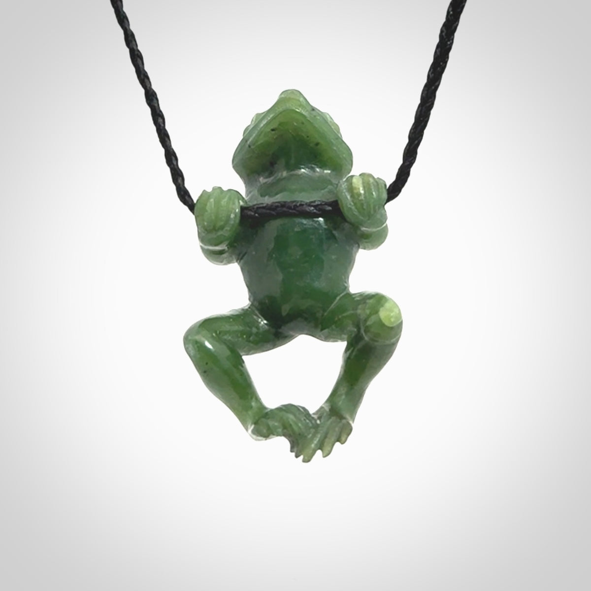 Hand carved jade frog pendant with adjustable cord.