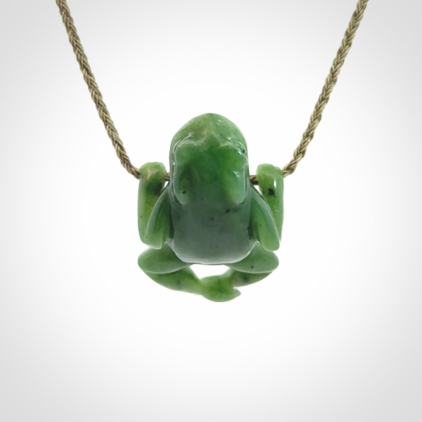 Hand carved jade frog pendant with adjustable cord.