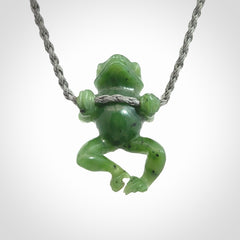 Hand carved jade frog pendant with adjustable cord.