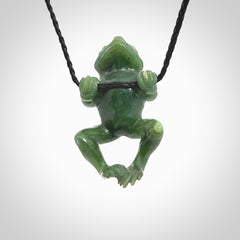 Hand carved jade frog pendant with adjustable cord.