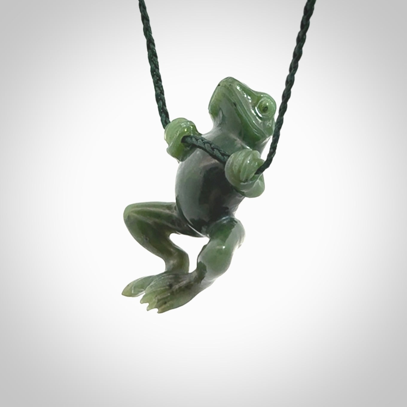 Hand carved jade frog pendant with adjustable cord.