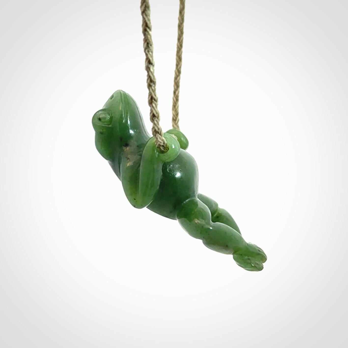 Hand carved jade frog pendant with adjustable cord.
