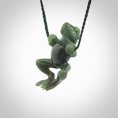 Hand carved jade frog pendant with adjustable cord.