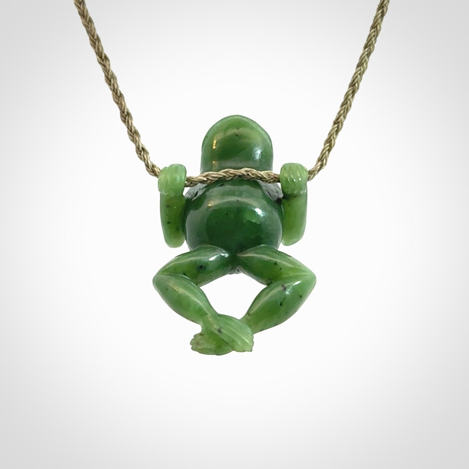 Hand carved jade frog pendant with adjustable cord.