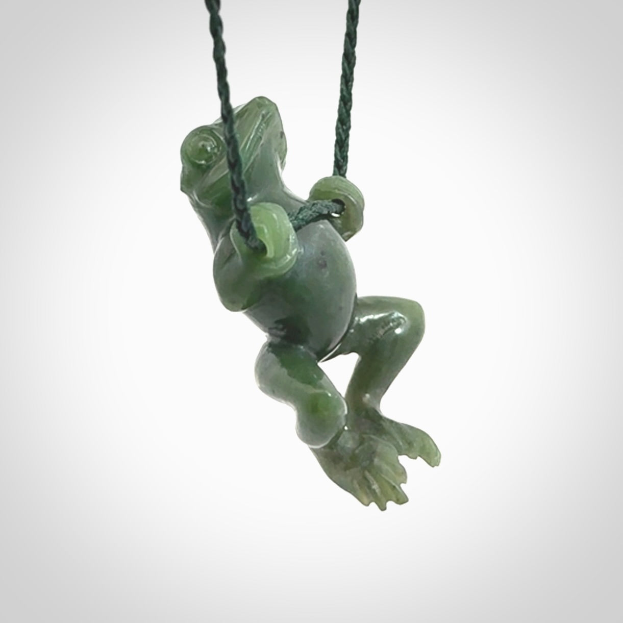 Hand carved jade frog pendant with adjustable cord.
