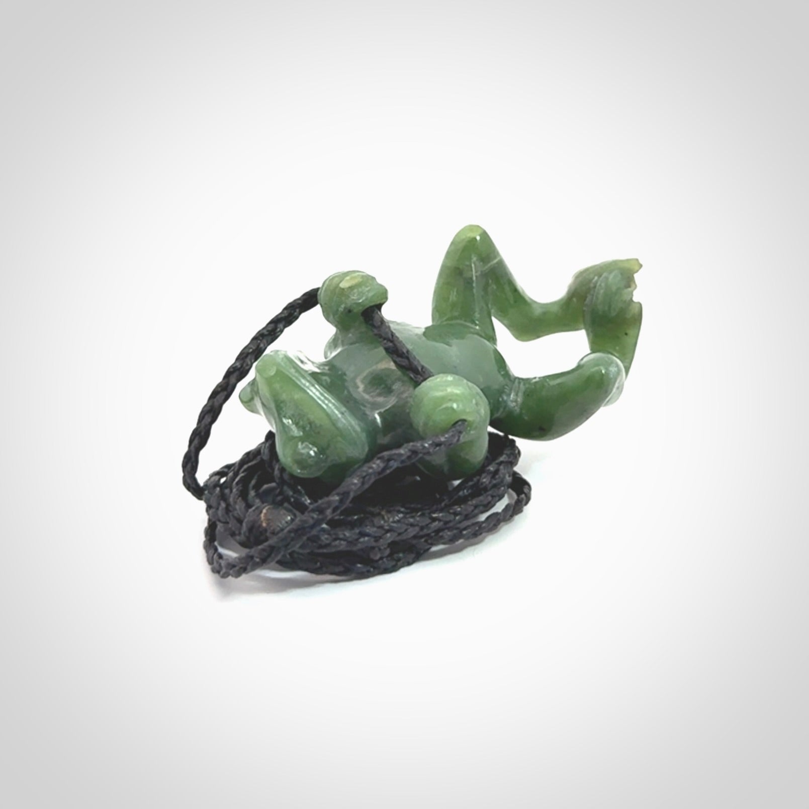 Hand carved jade frog pendant with adjustable cord.