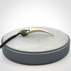 Hand crafted sterling silver with jade huia pendant
