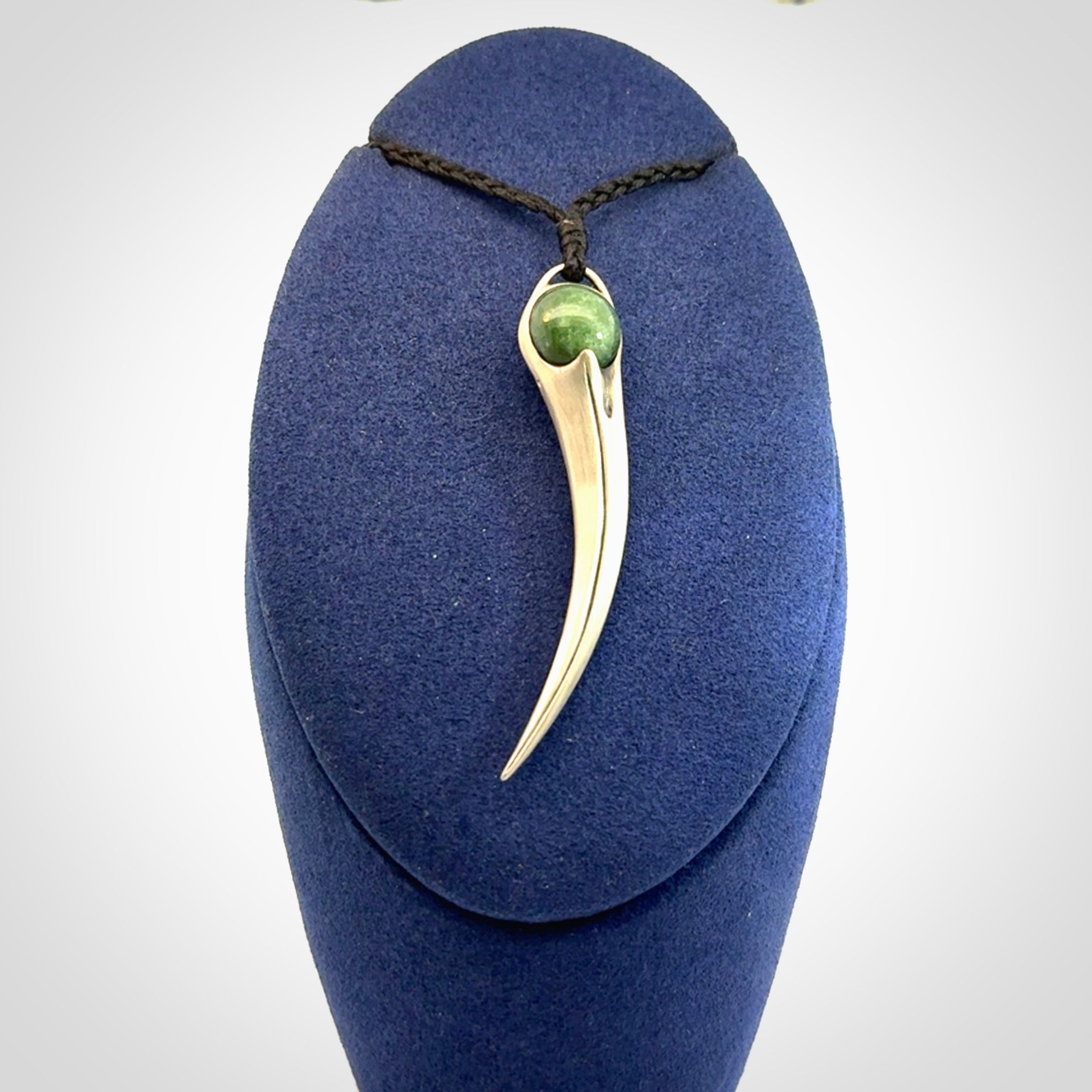 Hand crafted sterling silver with jade huia pendant