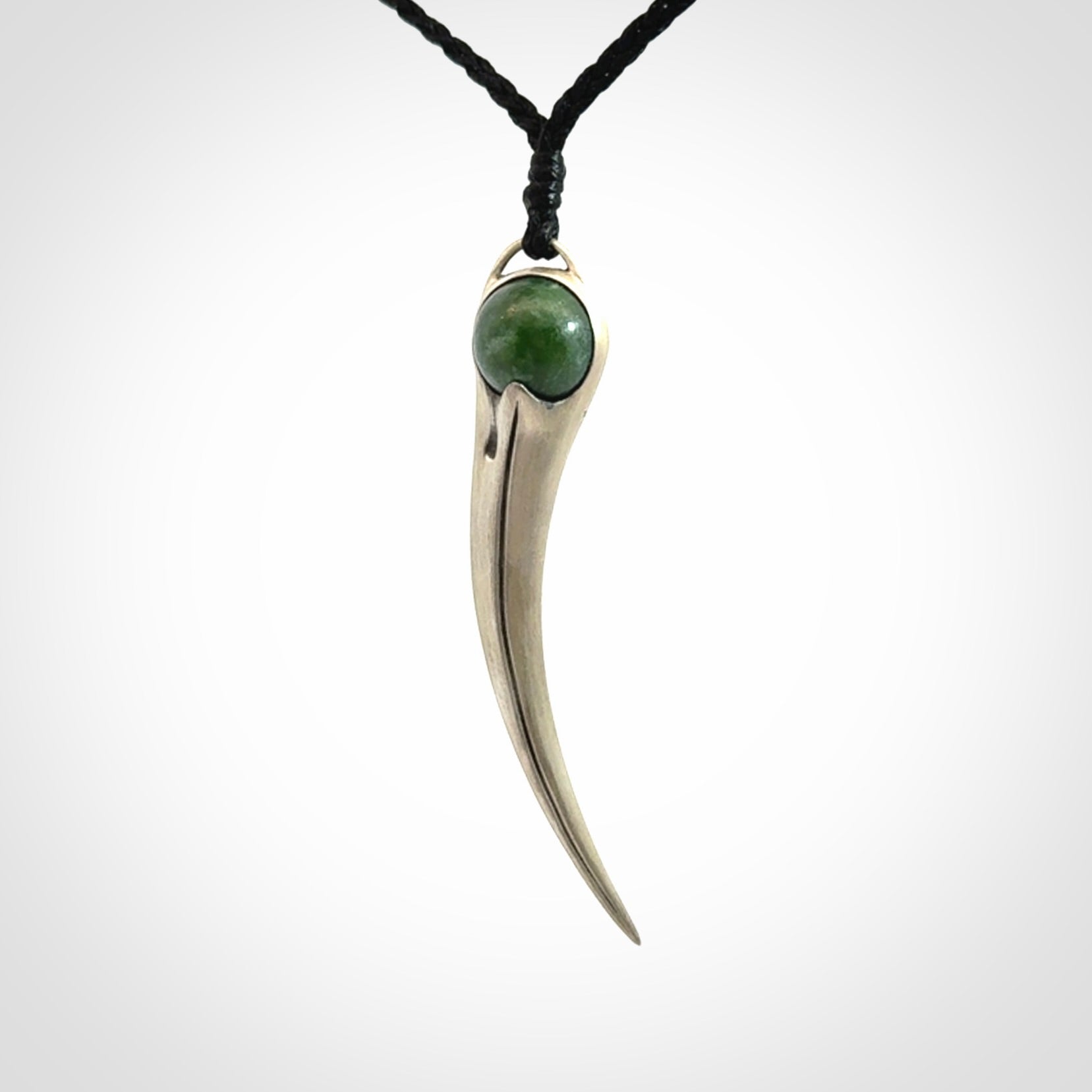 Hand crafted sterling silver with jade huia pendant