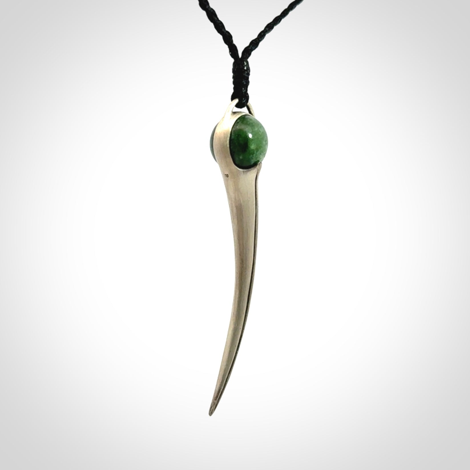 Hand crafted sterling silver with jade huia pendant