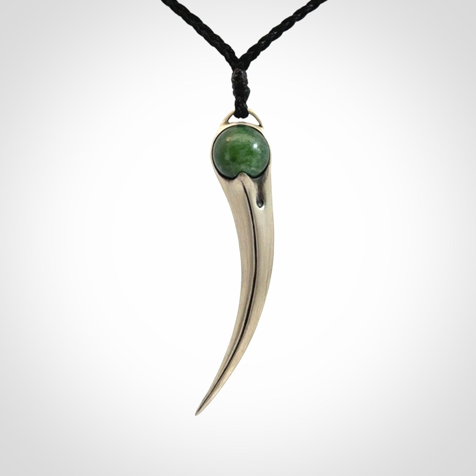 Hand crafted sterling silver with jade huia pendant