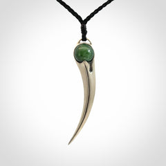 Hand crafted sterling silver with jade huia pendant