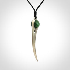 Hand crafted sterling silver with jade huia pendant