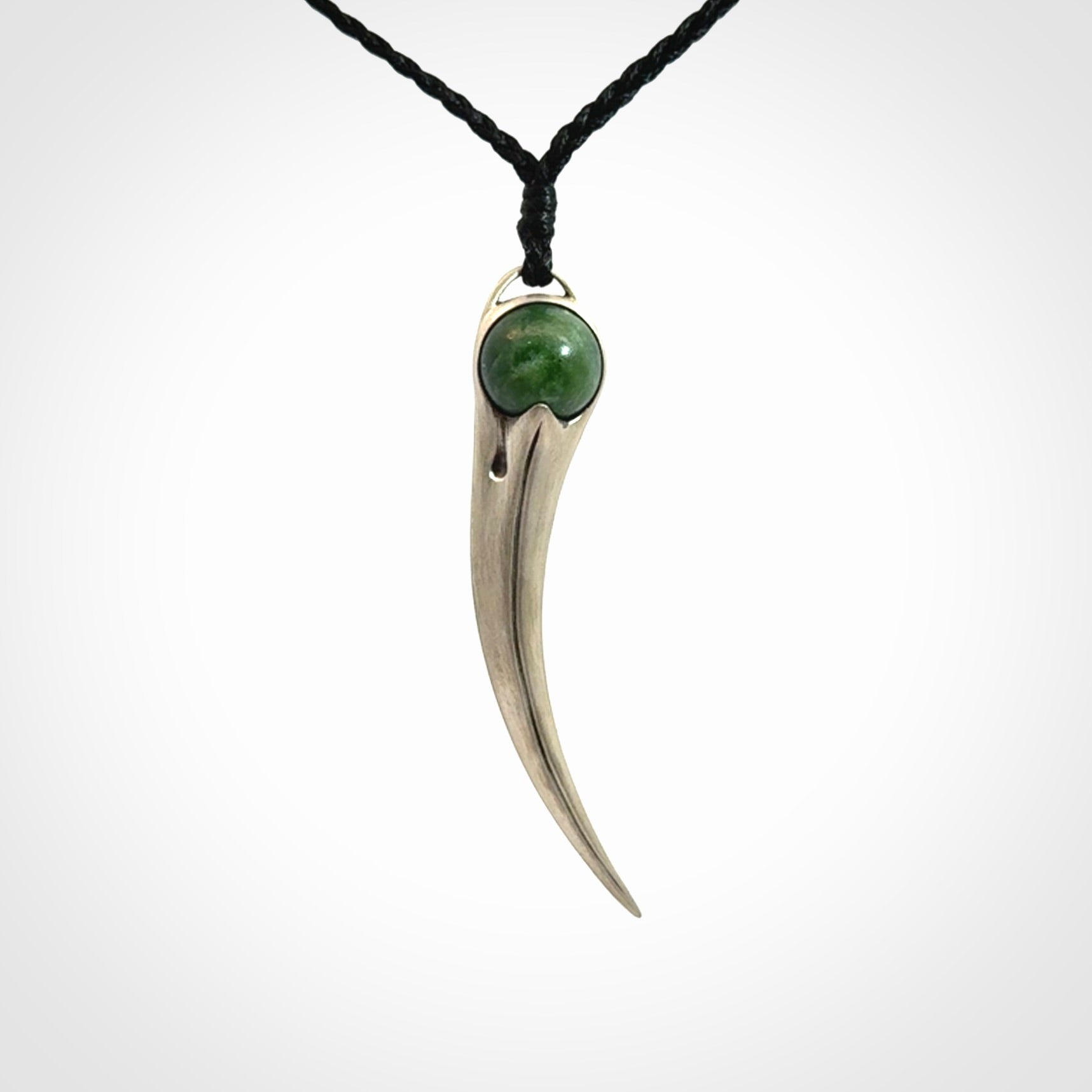 Hand crafted sterling silver with jade huia pendant
