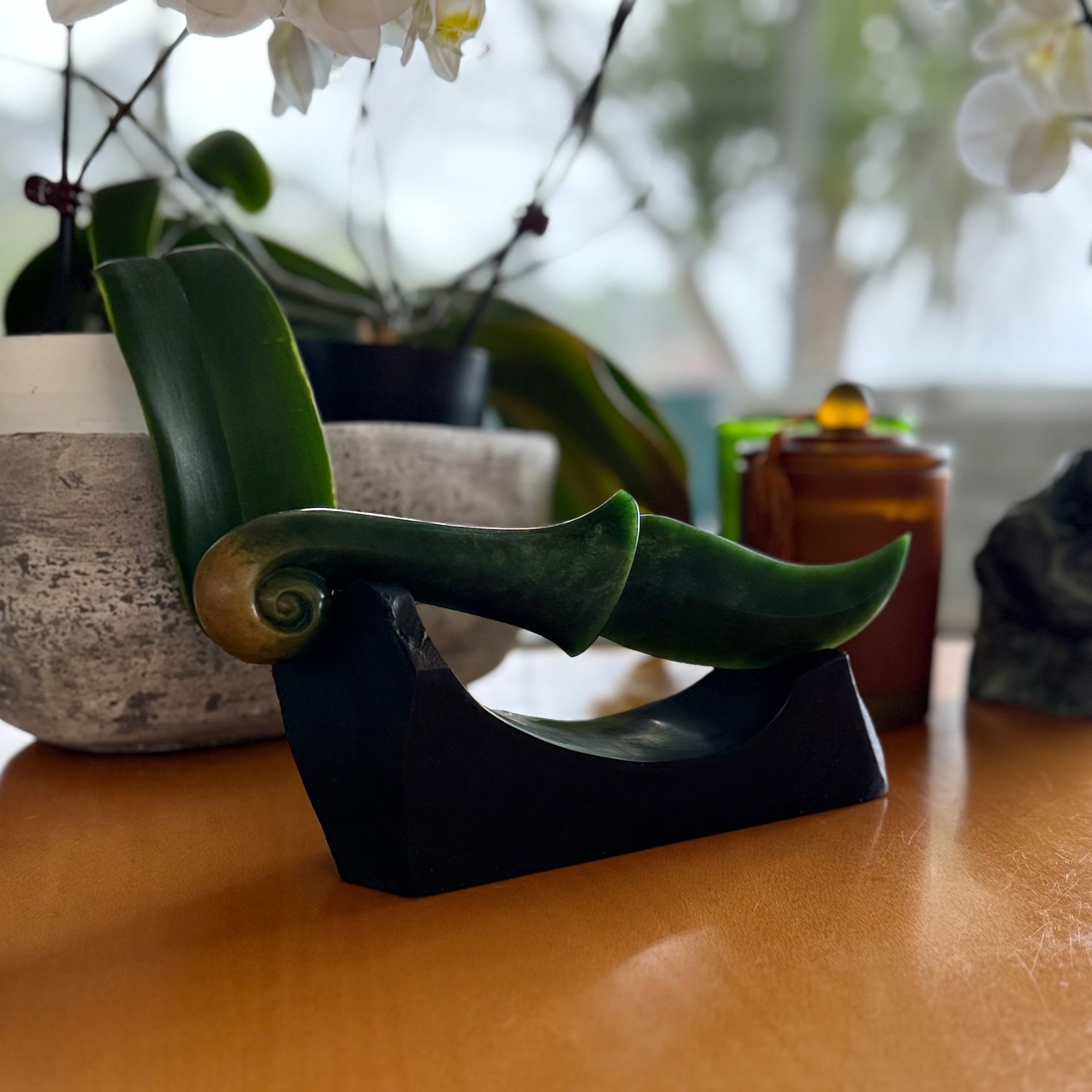 Hand carved large New Zealand Flower Jade knife with koru carving displayed in a Argillite stone stand sculpture. Hand carved here in New Zealand by Ric Moor. This is a 'one only' sculpture, a beautiful display piece.