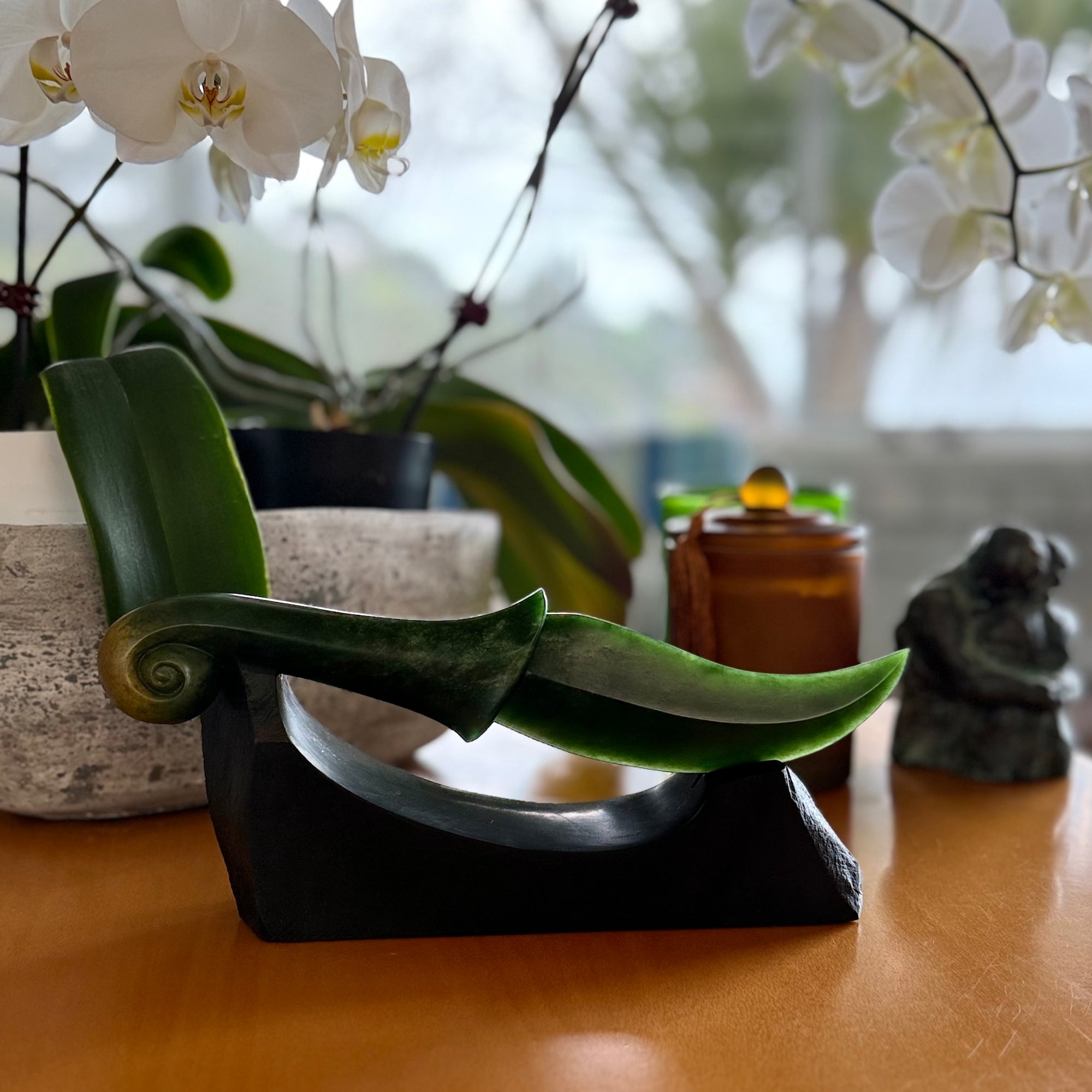 Hand carved large New Zealand Flower Jade knife with koru carving displayed in a Argillite stone stand sculpture. Hand carved here in New Zealand by Ric Moor. This is a 'one only' sculpture, a beautiful display piece.