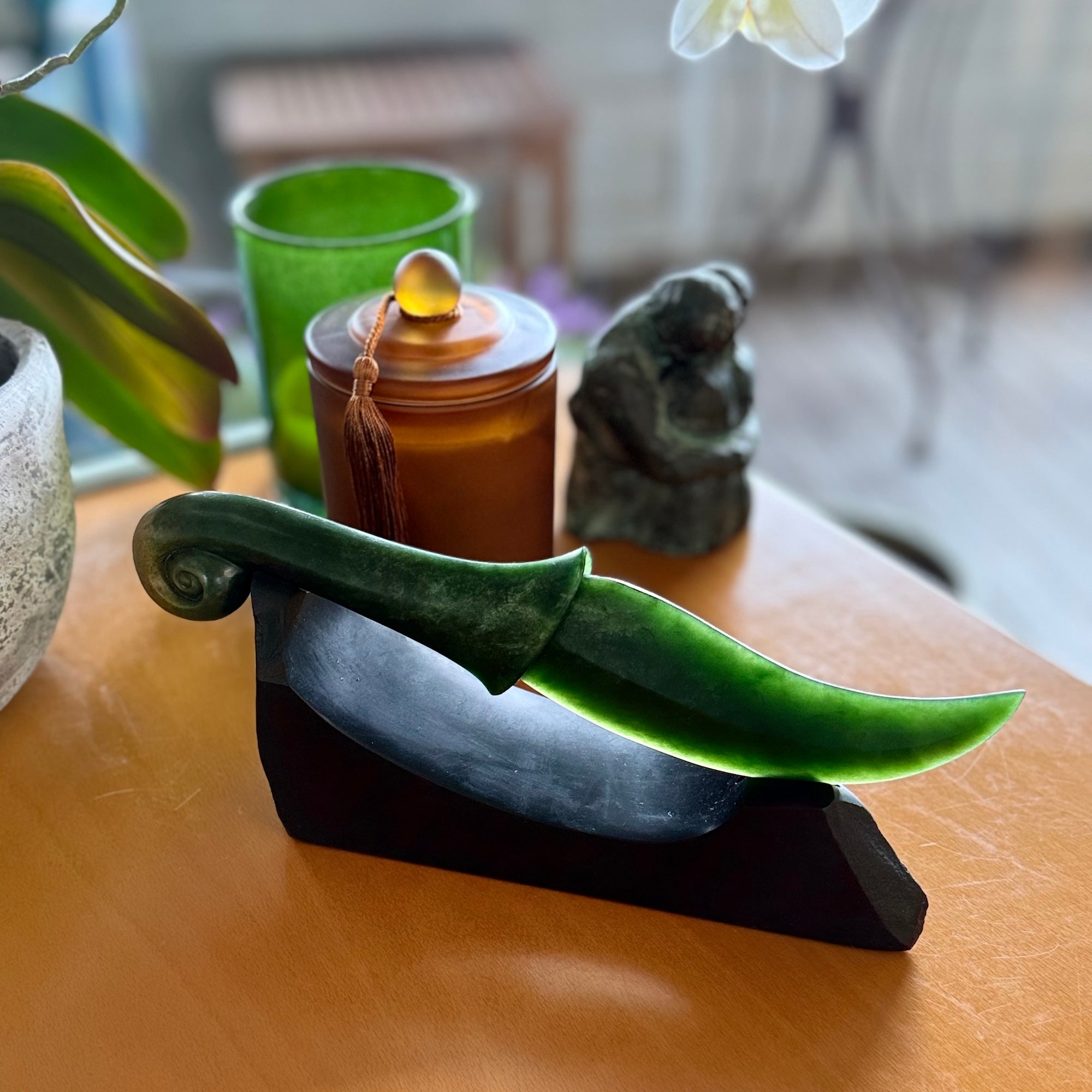 Hand carved large New Zealand Flower Jade knife with koru carving displayed in a Argillite stone stand sculpture. Hand carved here in New Zealand by Ric Moor. This is a 'one only' sculpture, a beautiful display piece.