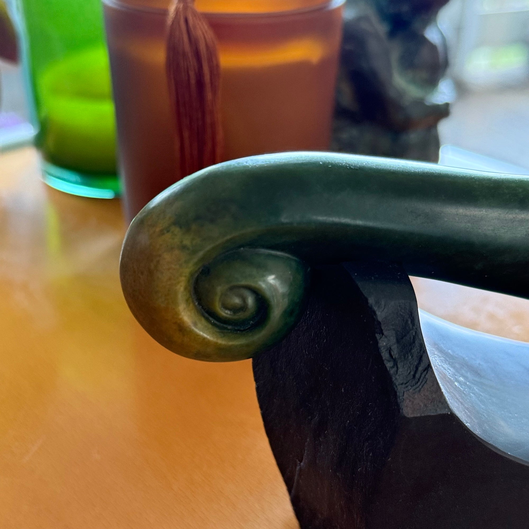 Hand carved large New Zealand Flower Jade knife with koru carving displayed in a Argillite stone stand sculpture. Hand carved here in New Zealand by Ric Moor. This is a 'one only' sculpture, a beautiful display piece.