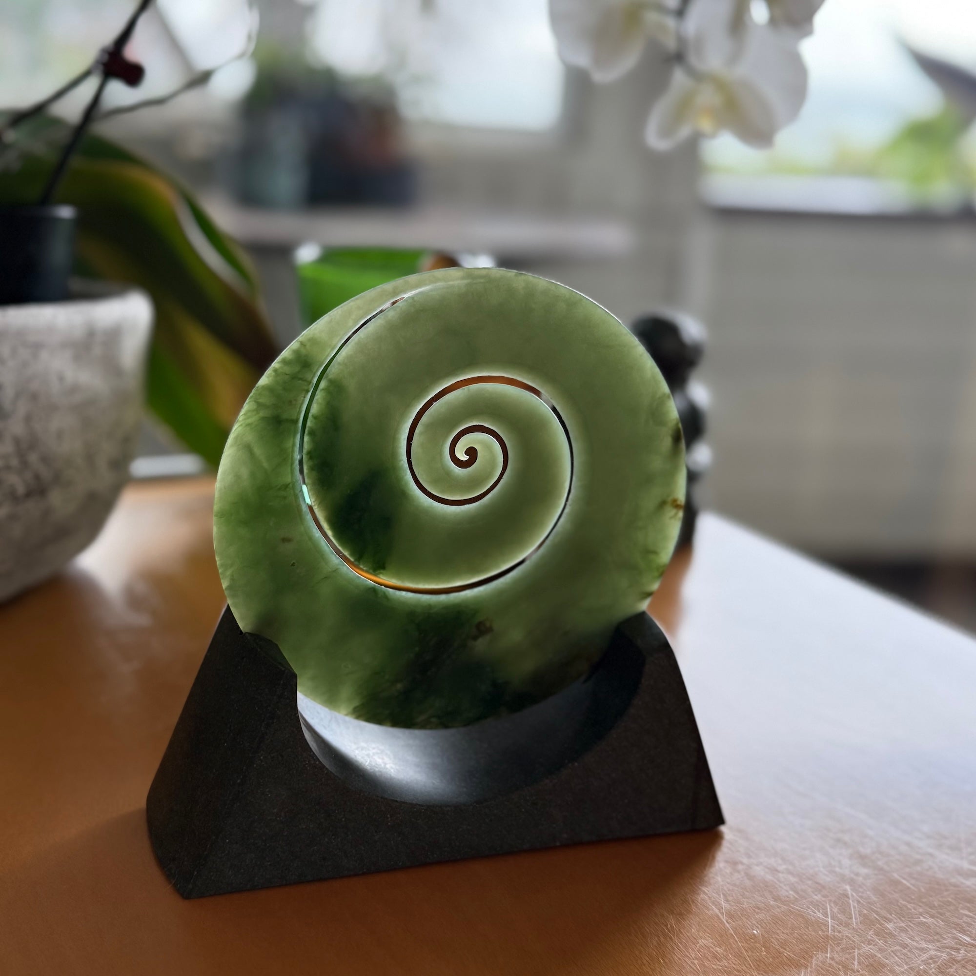 Hand carved large New Zealand Inanga Jade Koru with Greywacke stand sculpture. Hand carved here in New Zealand by Ric Moor. This is a 'one only' sculpture, a beautiful display piece.