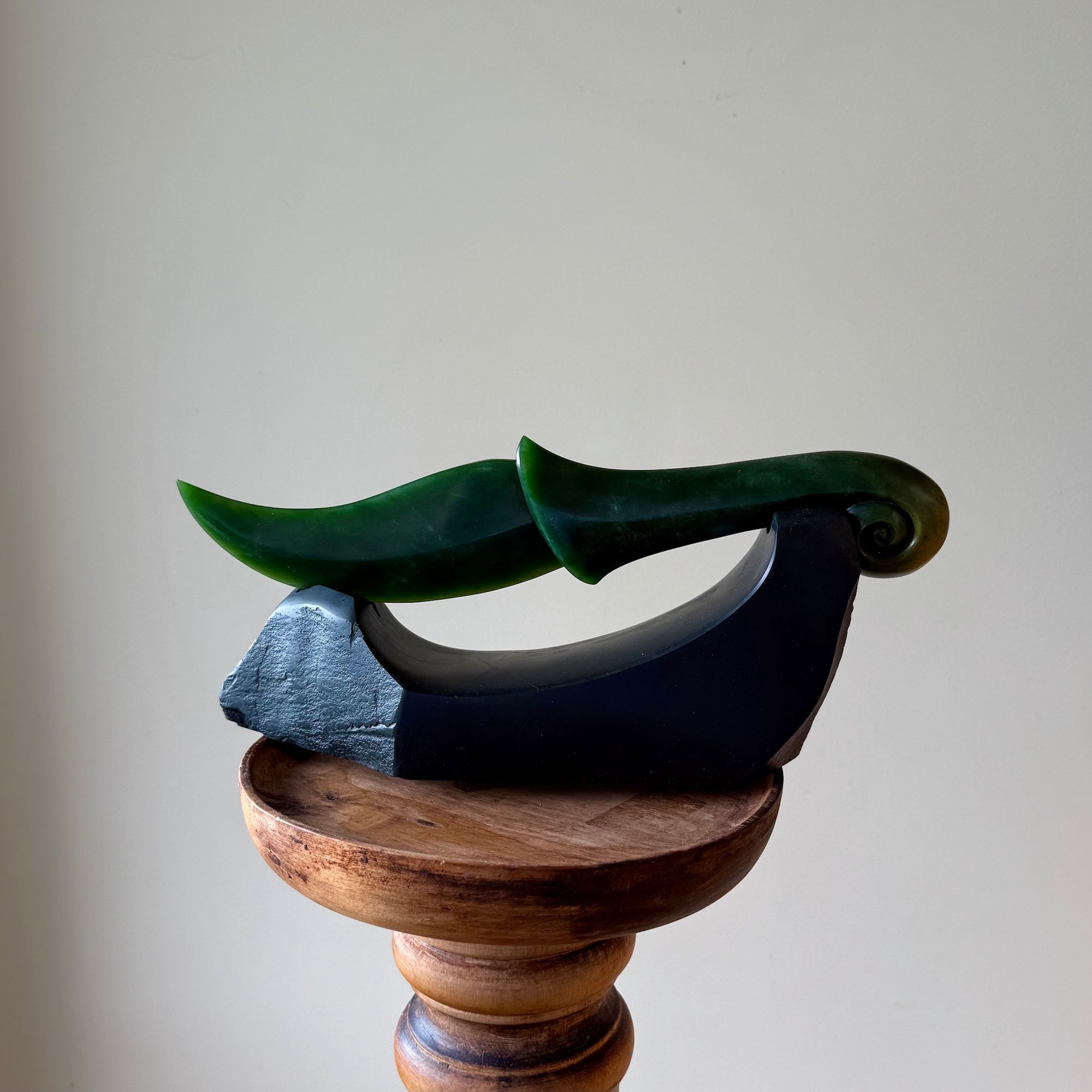 Hand carved large New Zealand Flower Jade knife with koru carving displayed in a Argillite stone stand sculpture. Hand carved here in New Zealand by Ric Moor. This is a 'one only' sculpture, a beautiful display piece.