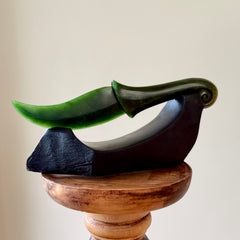 Hand carved large New Zealand Flower Jade knife with koru carving displayed in a Argillite stone stand sculpture. Hand carved here in New Zealand by Ric Moor. This is a 'one only' sculpture, a beautiful display piece.