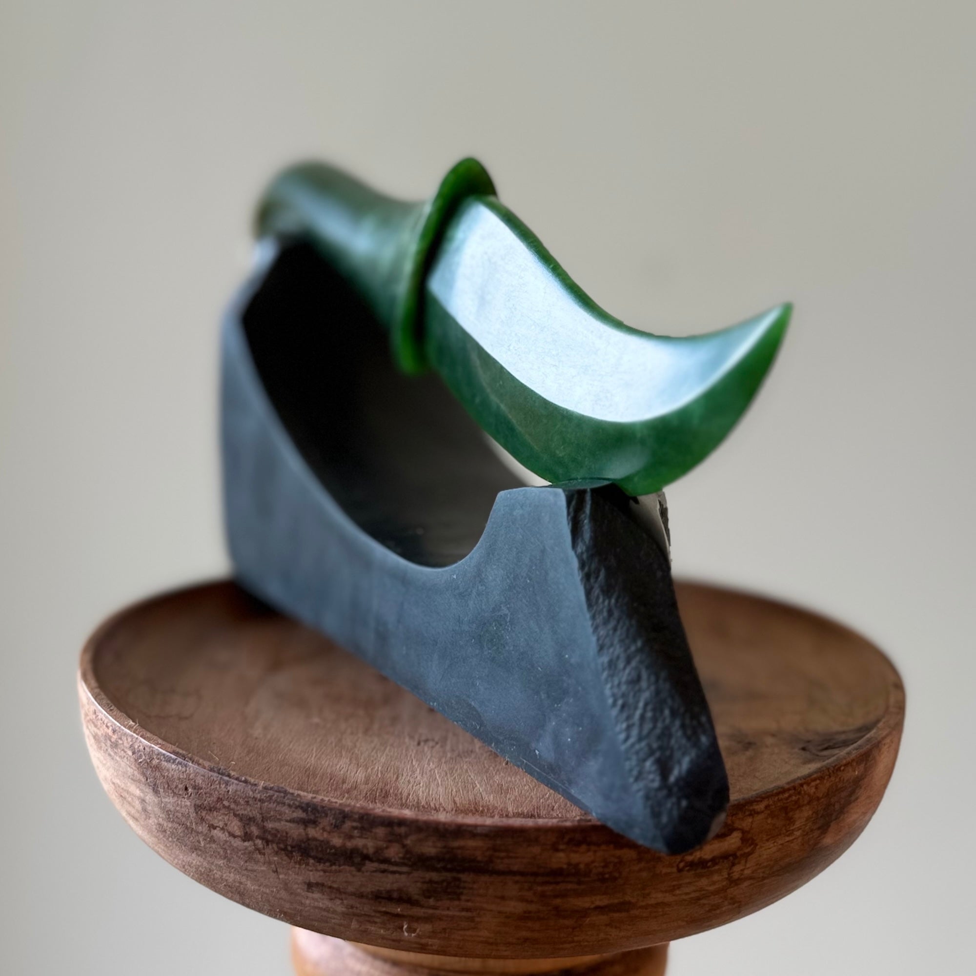 Hand carved large New Zealand Flower Jade knife with koru carving displayed in a Argillite stone stand sculpture. Hand carved here in New Zealand by Ric Moor. This is a 'one only' sculpture, a beautiful display piece.
