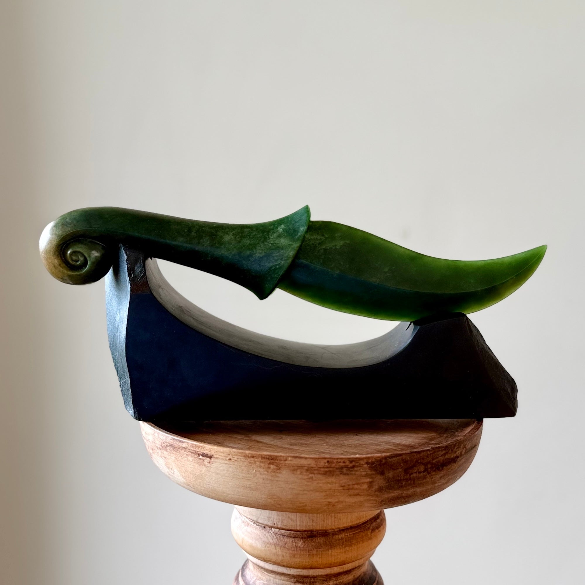 Hand carved large New Zealand Flower Jade knife with koru carving displayed in a Argillite stone stand sculpture. Hand carved here in New Zealand by Ric Moor. This is a 'one only' sculpture, a beautiful display piece.