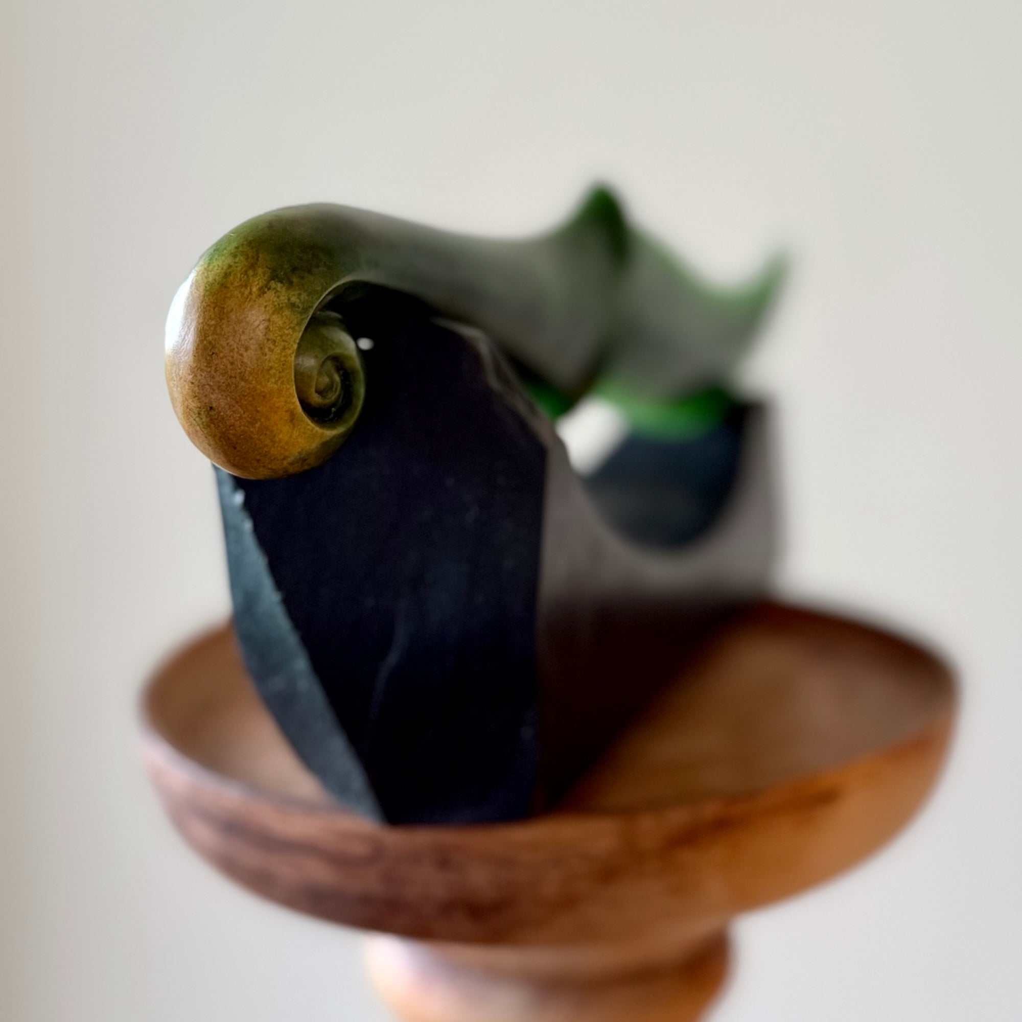 Hand carved large New Zealand Flower Jade knife with koru carving displayed in a Argillite stone stand sculpture. Hand carved here in New Zealand by Ric Moor. This is a 'one only' sculpture, a beautiful display piece.